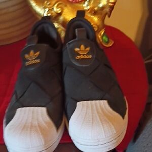 Adidas Black and White Slip-On Sneakers with Gold Logo